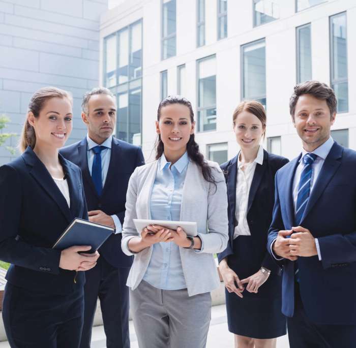 businesspeople-standing-outside-office-building (1)